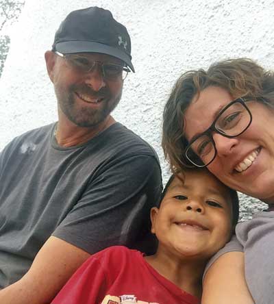 Al and Becca with boy from Hope House